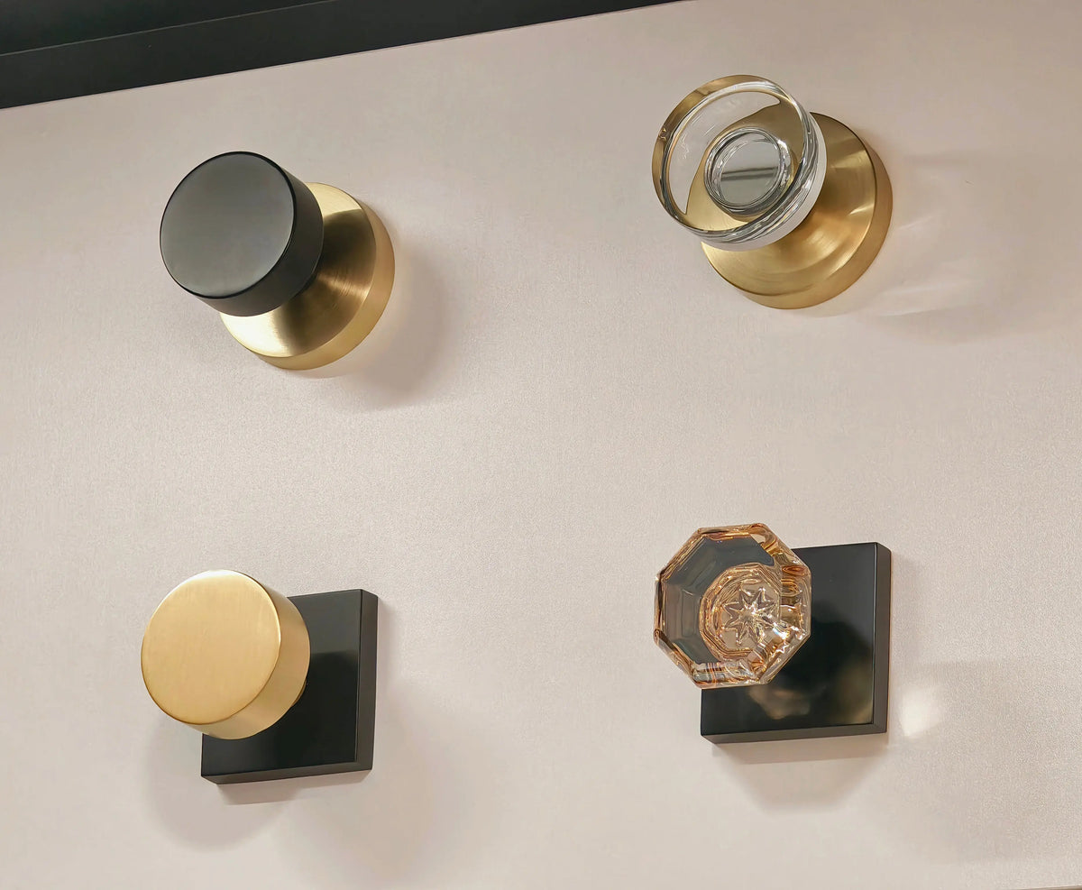 Set of door handles and knobs on a neutral background