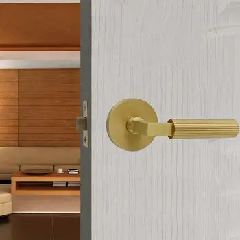 Gold color round lock plate pull straight knurled door handle fitted to the door