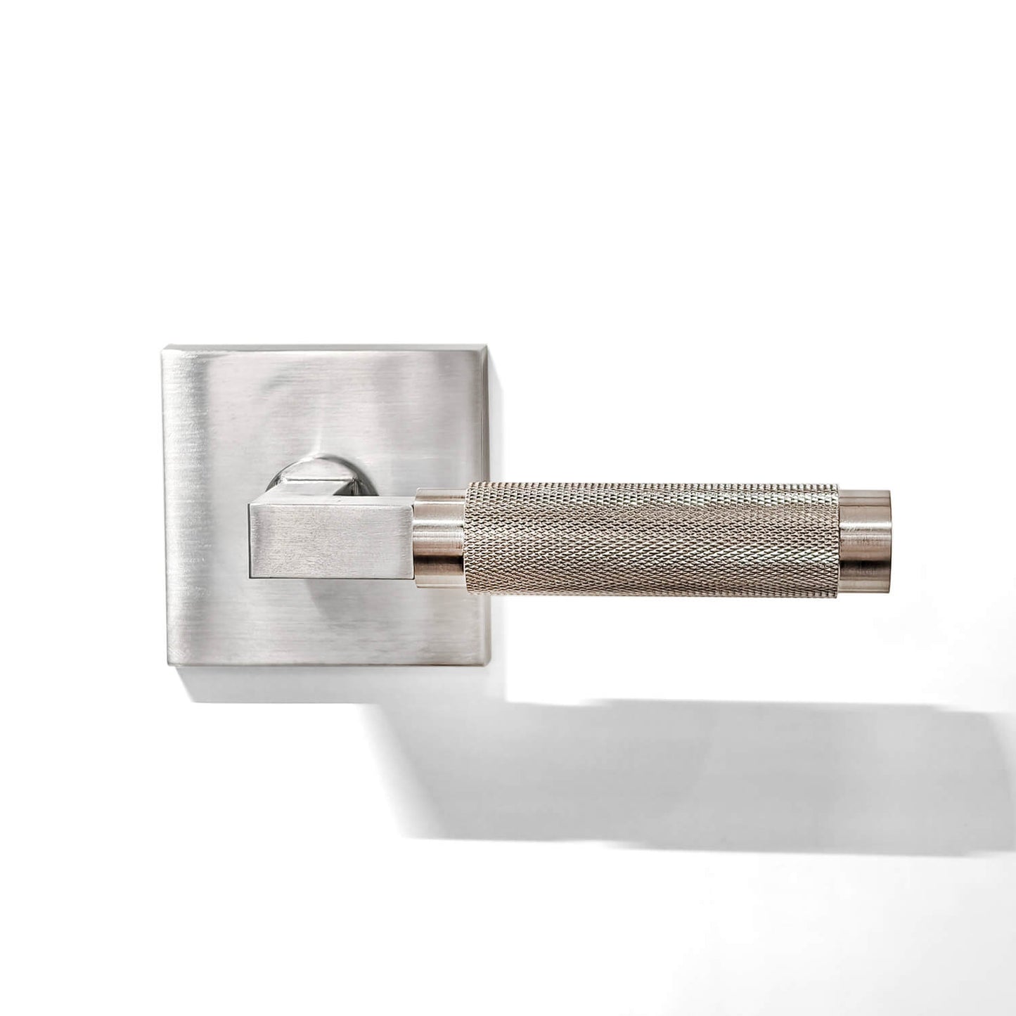 Silver-coloured semi-knurled rectangular locking plate door handle