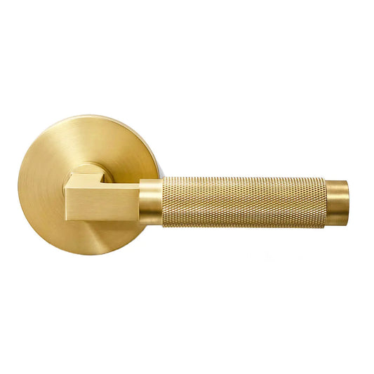 Gold door handle on a white background