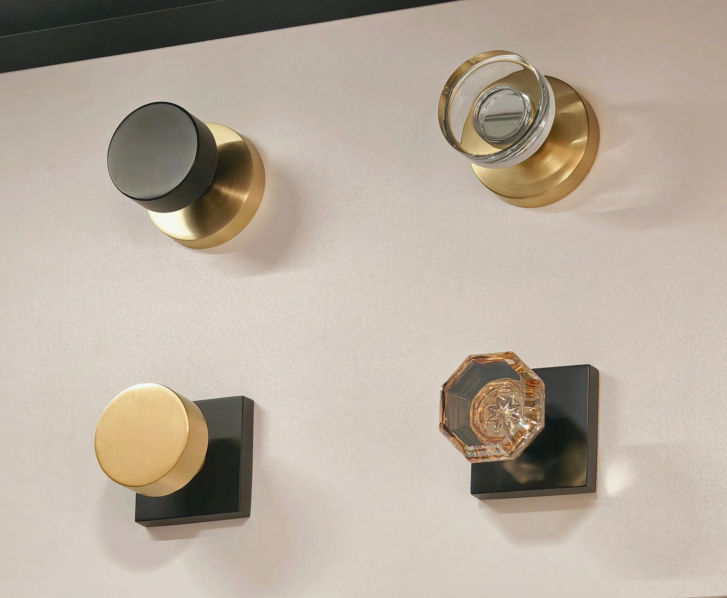 Set of door handles and knobs on a neutral background