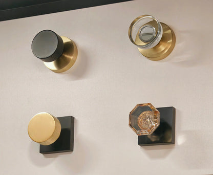 Set of door handles and knobs on a neutral background