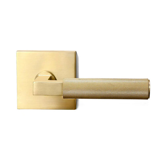Gold door handle on a white background